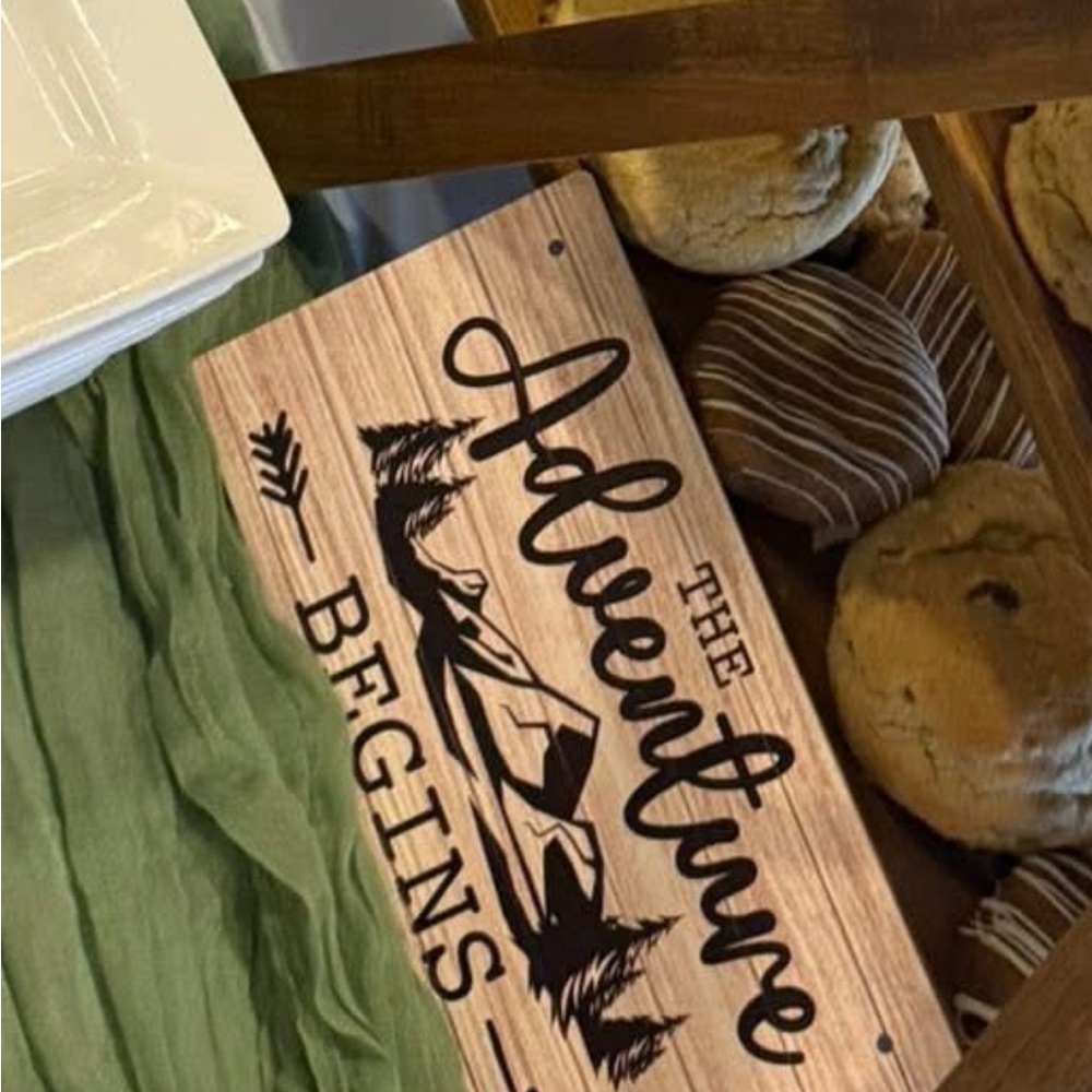 Adventure Begins wooden signs and sage green table runners